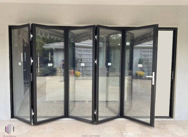 Photo 1 of  DOORS  Teza 60 144-in x 80-in Tempered Clear Glass Black Aluminum Left-Hand Outswing 4-panel Door Folding Patio Door
