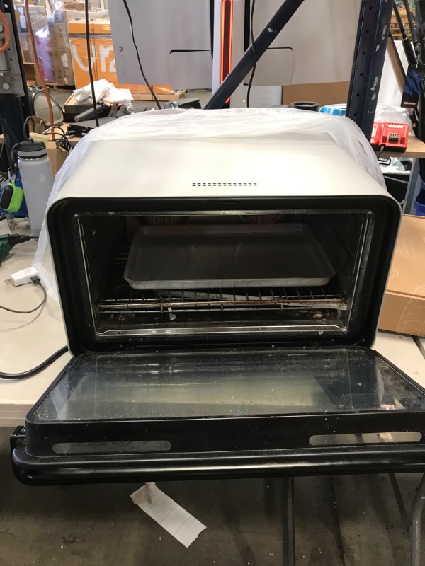 Photo 2 of PARTS ONLY DAMAGED 
June Oven Plus Bundle (3rd Gen); Countertop convection smart oven. Multiple appliances in one. Air fryer, slow cooker, dehydrator, convection oven, toaster oven, warming drawer, broiler, and more.