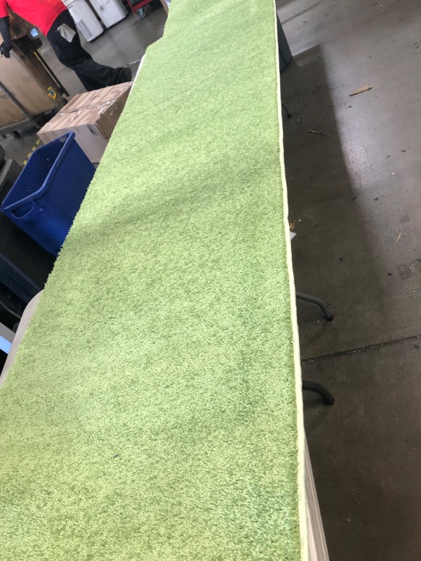 Photo 3 of (TORN BACK SIDE)
14' x 30" Green rug runner