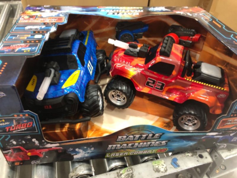 Photo 2 of Jada Toys Battle Machines 1:16 Laser Combat RC Remote Control Car 2-Pack, 2.4 GHZ Red/Blue Truck, Toys for Kids and Adults (251109005)
