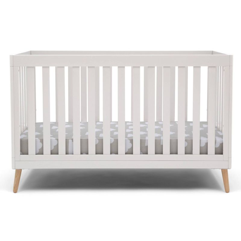 Photo 1 of Delta Children Essex 4-in-1 Convertible Baby Crib, Bianca White/Natural Legs
