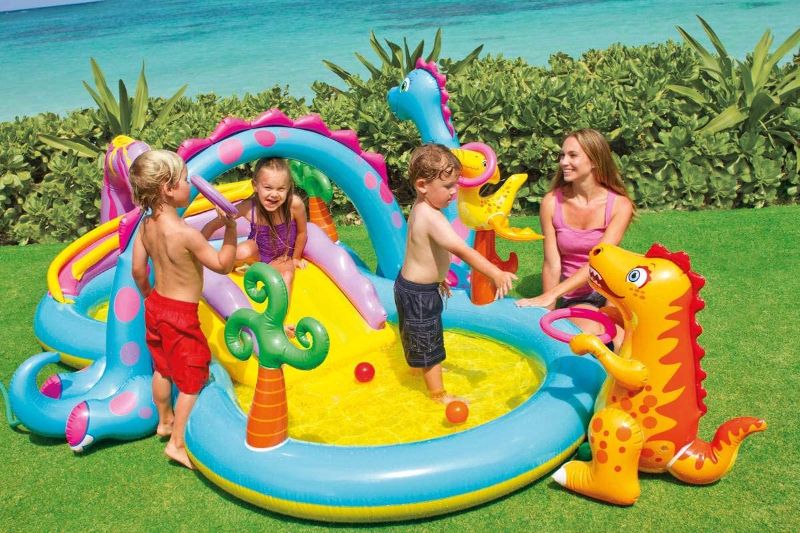 Photo 1 of Intex 11ft x 7.5ft x 44in Dinoland Backyard Play Center Kiddie Inflatable Swimming Pool with Slide, Dino Arch Water Sprayer and Games for Ages 2+