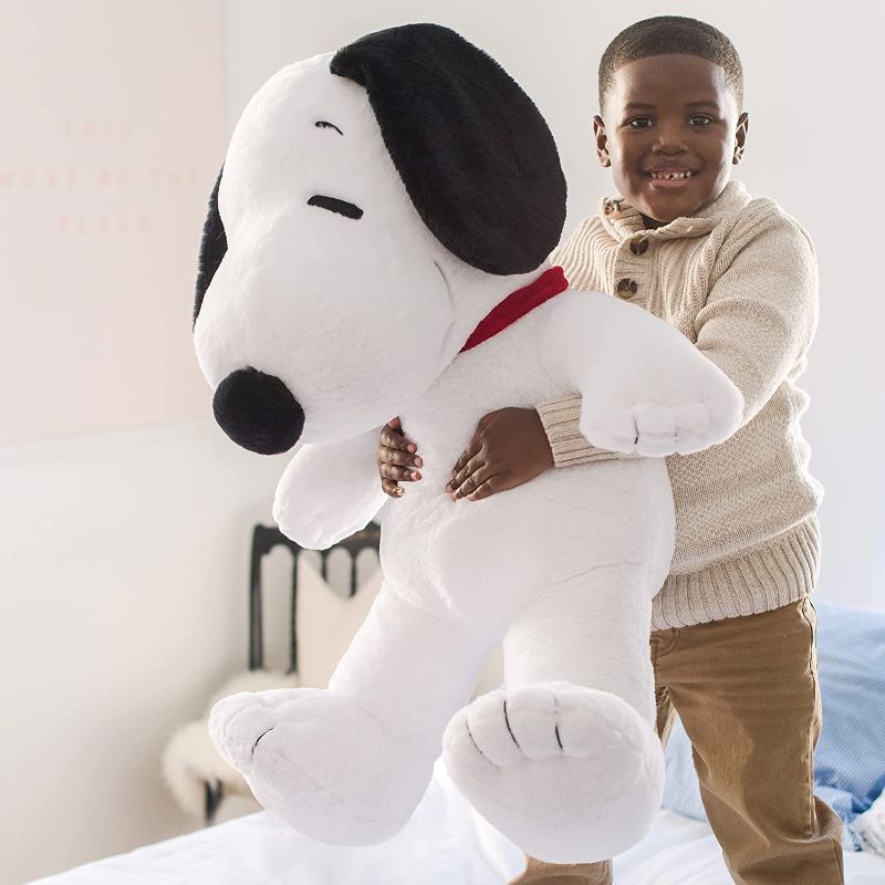 Photo 1 of **HAS SMALL STAINS, ANS TEAR UNDER LEFT ARM**
Animal Adventure® | Peanuts® | Snoopy | 32"?Jumbo Collectible Plush

