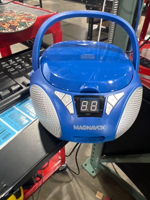 Photo 1 of Magnavox MD6924-BL Portable Top Loading CD Boombox with AM/FM Stereo Radio in Blue CD-R/CD-RW Compatible LED Display AUX Port Supported Programmable CD Player