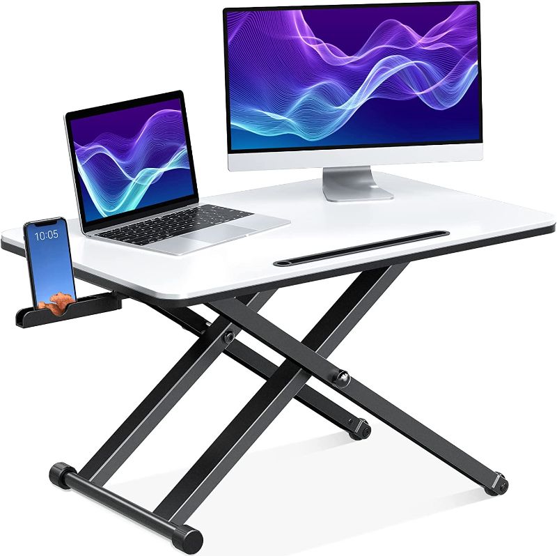 Photo 1 of ELIVED Standing Desk Converter with Phone Holder, 29" Height Adjustable Gas Spring Desk Riser, Table Top Stand Up Desk for Laptop and Monitor, Ergonomic Desktop Computer Workstation for Home Office
