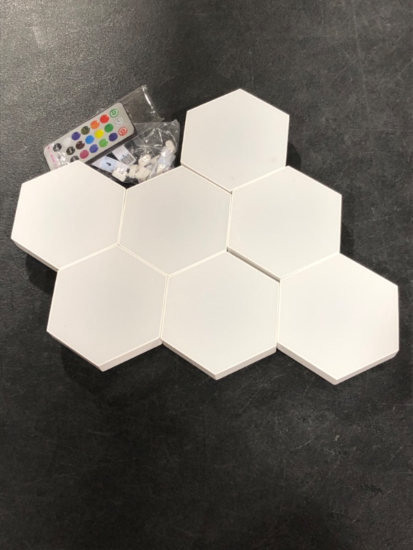 Photo 2 of HEXlights 7-Pack Hexagon Wall Lights, Touch & Remote Controlled RGB Wall Panels, Hexagon LED Lights Panels - Great for Living Room, Bedroom & Game Room Decor - Includes Stand for Tabletop
