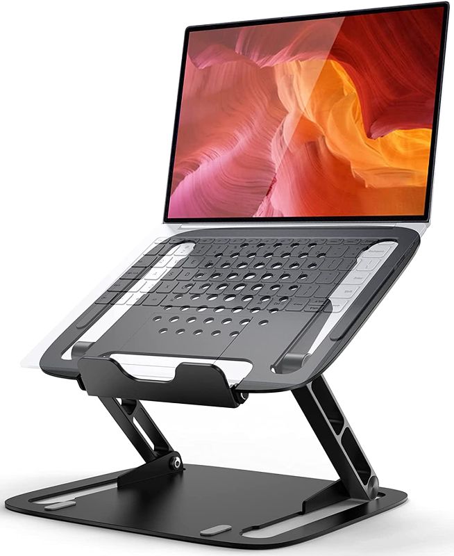 Photo 1 of Laptop Stand for Desk, Ergonomic Portable Computer Stand, Fast Heat Dissipation Hollow Design, Height Angle Adjustable Computer Laptop Holder Compatible with All Laptops (Black)
