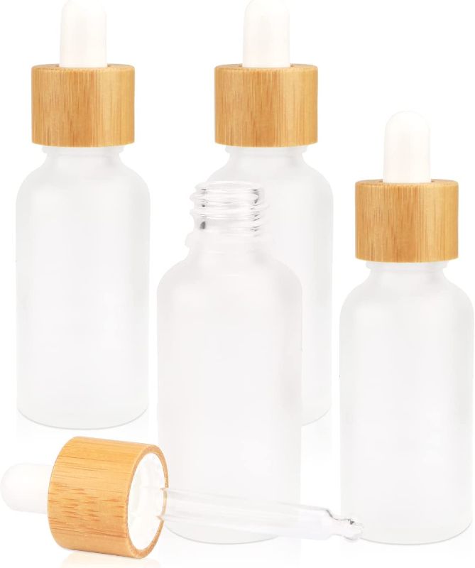 Photo 1 of 4 Pack Frosted Glass Dropper Bottles,Essential Oil Bottles With Eye Dropper And Bamboo Lids Perfume Sample Vials Essence Liquid Cosmetic Containers (30ml/1oz)
