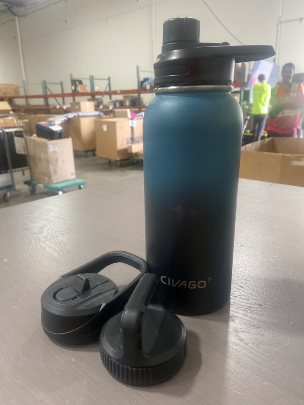 Photo 1 of CIVAGO 64 oz Insulated Water Bottle With Straw, Half Gallon Stainless Steel Sports Water Flask Jug with 3 Lids (Straw, Spout and Handle Lid), Large Metal Thermo Cup Mug, Indigo Black
