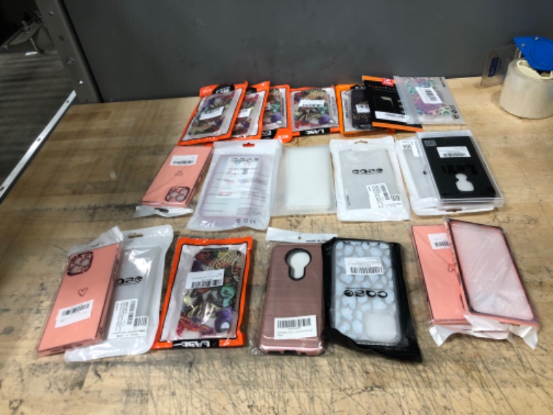 Photo 1 of Bundle of various cell phone casesand screen protectors.