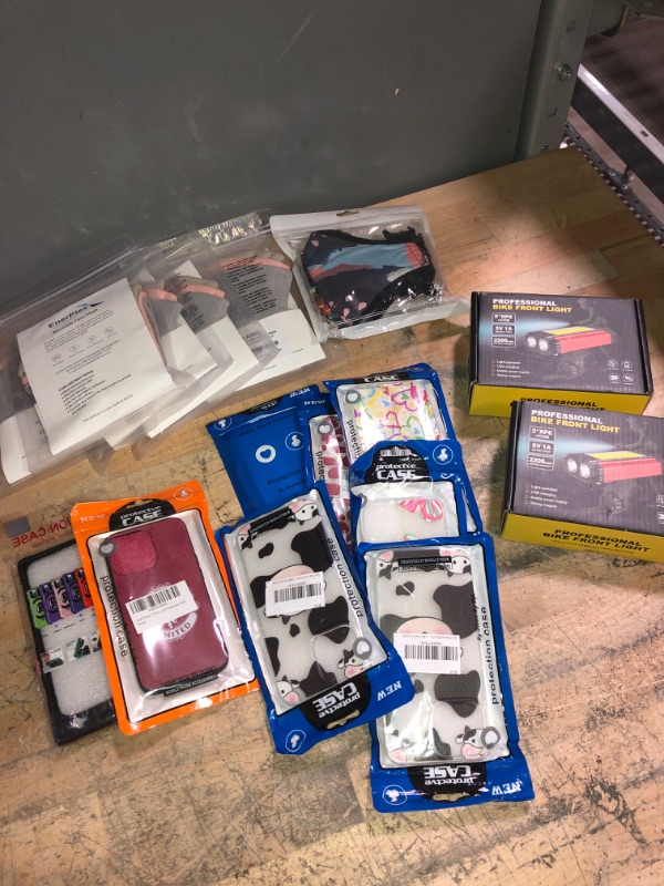 Photo 1 of **BUNDLE OF MIXED ITEAMS-PHONE CASES/FACE MASK/BIKE LIGHTS**