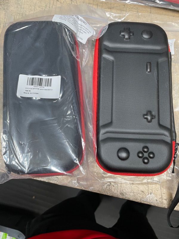 Photo 2 of SOLD AS IS**NO REFUND. EOVOLA Hard Portable Carry Case for Nintendo Switch lite. **2 PACKS