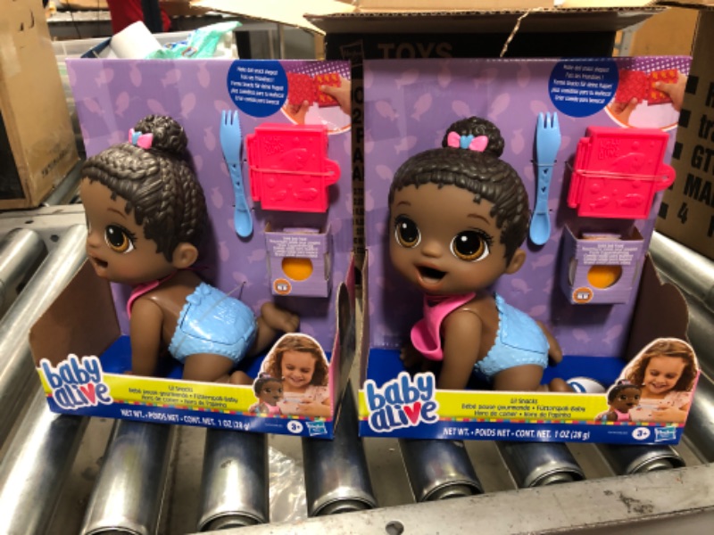 Photo 1 of 2 DOLLS 
Baby Alive Lil Snacks Doll with Black Hair Eats and Poops

