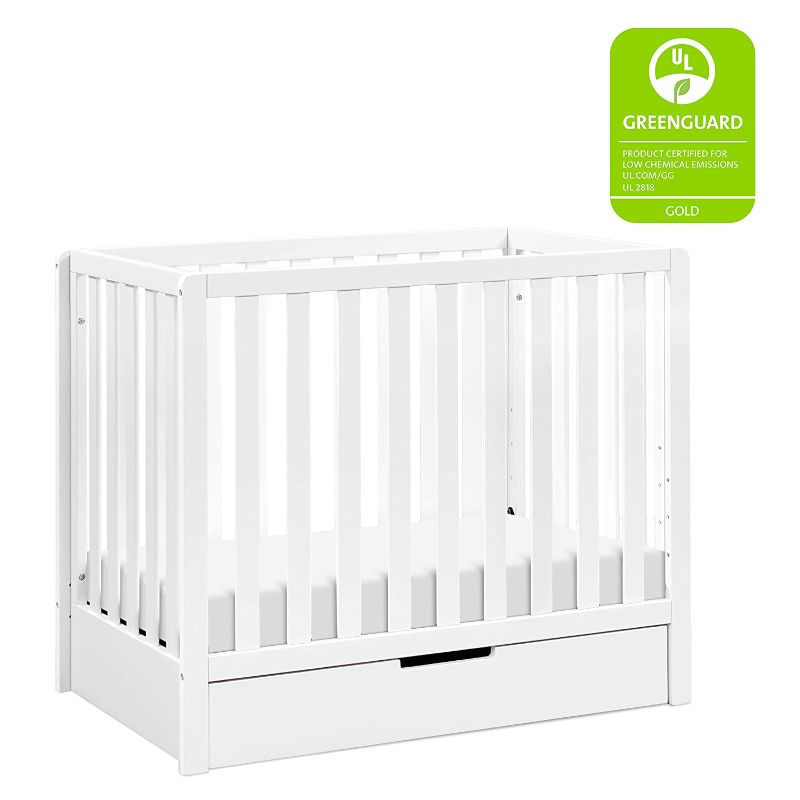 Photo 1 of Carter's by DaVinci Colby 4-in-1 Convertible Mini Crib with Trundle Drawer in White, Greenguard Gold Certified, Undercrib Storage