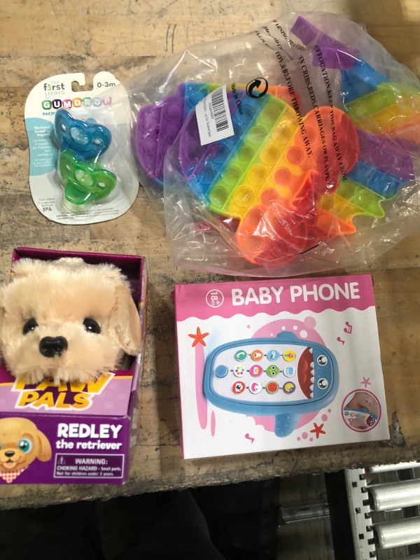 Photo 1 of *** KID BUNDLE***
4 POP ITS
Baby Shark Cell Phone Toy
PAW PALS DOG
PACIFIERS
