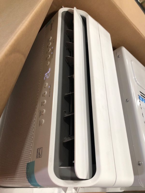 Photo 1 of Midea 12,000 BTU U-Shaped Smart Inverter Window Air Conditioner–Cools up to 550 Sq. Ft., Ultra Quiet with Open Window Flexibility, Works with Alexa/Google Assistant, 35% Energy Savings, Remote Control
