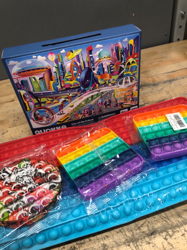 Photo 1 of **BUNDLE OF KIDS POP ITS AND PUZZLE**