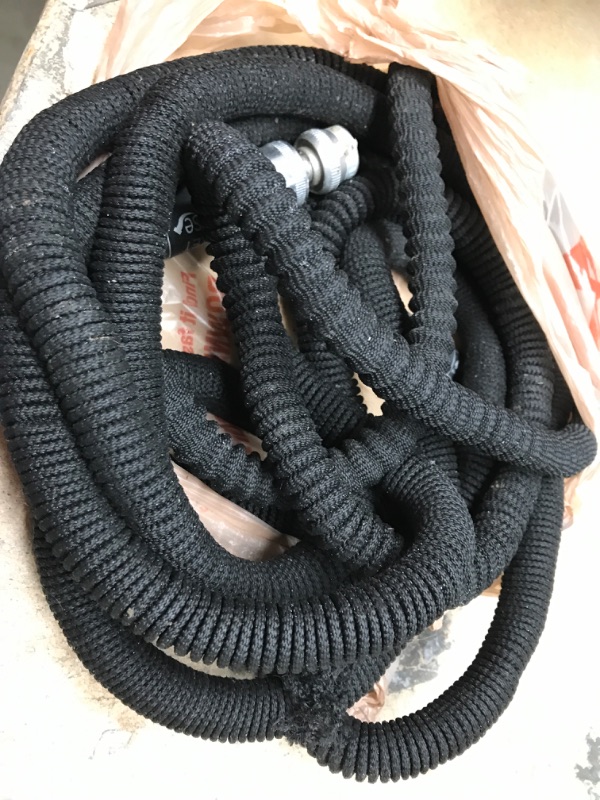 Photo 2 of **MINOR TEAR** Pocket Hose
Silver Bullet 3/4 in. Dia x 50 ft. Standard Duty Expandable Water Hose