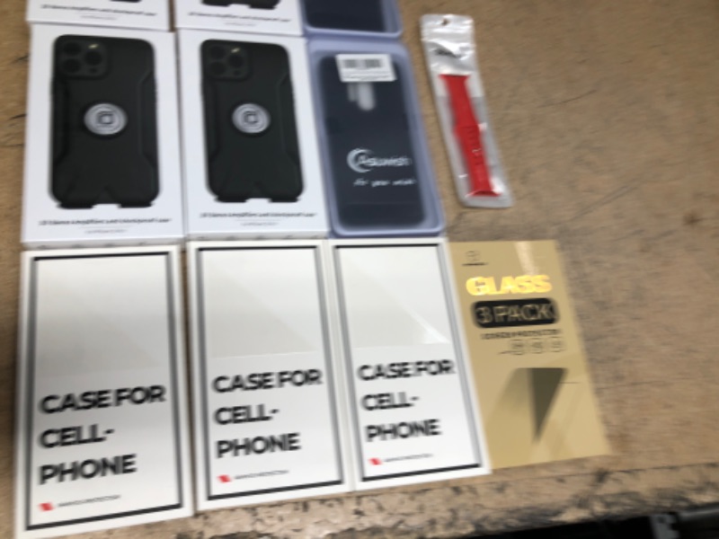 Photo 2 of Bundle of various cell phone cases, screen protectors, and a sport watch band