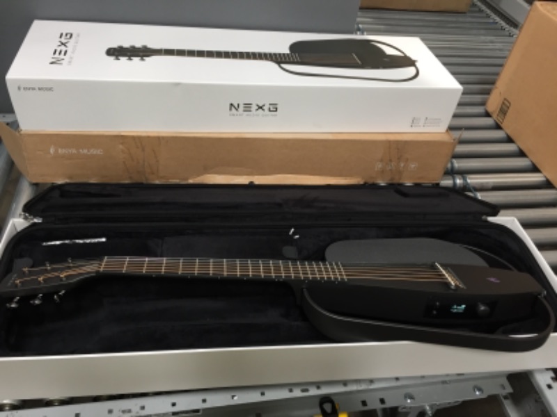 Photo 2 of Enya NEXG Acoustic-Electric Carbon Fiber Audio Guitar Smart Acustica Guitarra for Adults with 50W Wireless Speaker, Preamp, Wireless Microphone, Hi-Fi Monitor Earphones, Strap, and Case(Black)

**TESTED, POWERS ON!
