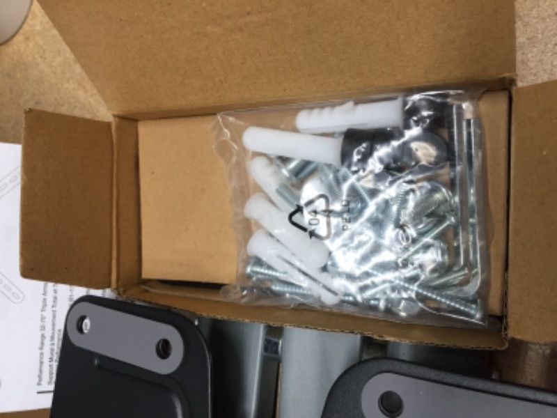 Photo 1 of Amazon Basics Triple Arm Full Motion Articulating TV Wall Mount, fits TVs 32-70 " up to 55lbs