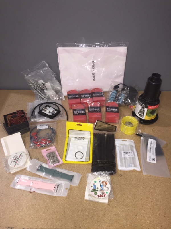 Photo 1 of **BUNDLE OF MIXED ITEMS-PARTY KNIFES/XMAS TREE DECOR/ROPELESS JUMP ROPE/WATCH BANDS/AUTO SCRUB SPONGE/WATER SPRINKLER/MUCH MORE**