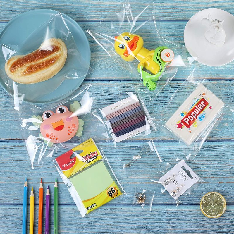 Photo 1 of 400 Pack 5" x 7" Thick Clear Cello Self Adhesive Seal Bags Durable Plastic Resealable Self-Sealing Poly Cellophane Bag Packaging Bakery Cookie Candy Card Gifts OPP Bags
