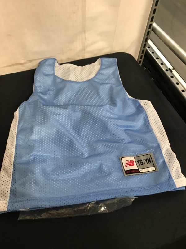 Photo 1 of KID'S NEW BALANCE REVERSIBLE JERSEY, SIZE YOUTH S/M