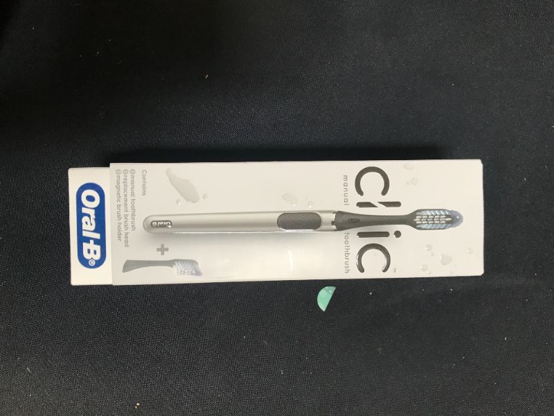 Photo 2 of Oral-B Clic Manual Toothbrush, Chrome Black, with 1 Bonus Replacement Brush Head and Magnetic Toothbrush Holder
