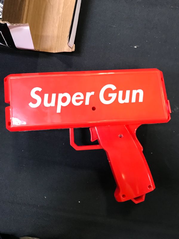 Photo 2 of LEOKKARR Red Money Gun Shooter, Toy Guns That Look Real, Prop Gun Cash Cannon for Game Movies Party Supplies with Play Money 100 Dollar Bills
