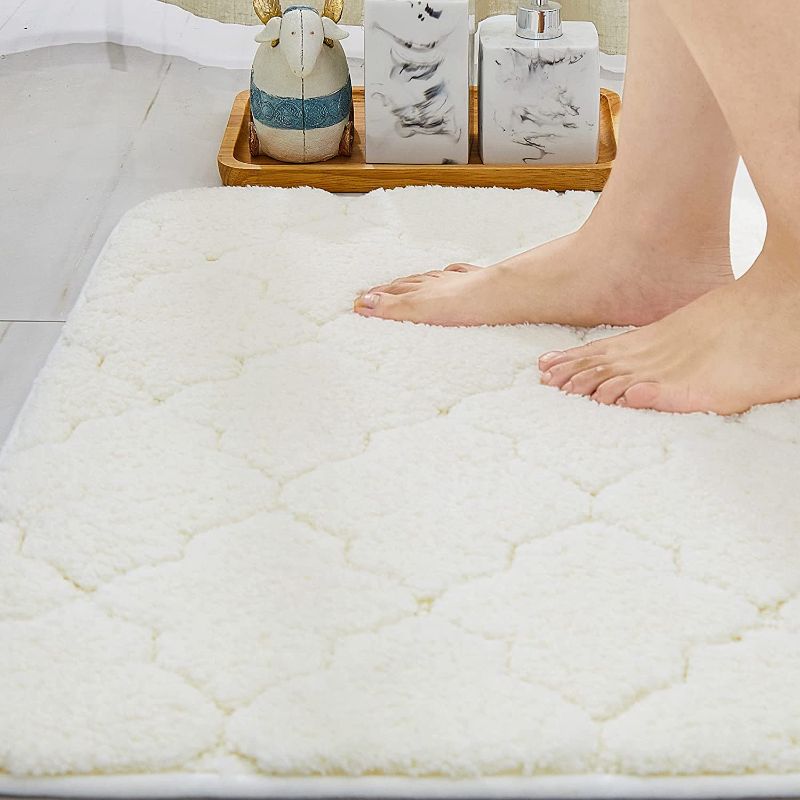 Photo 1 of COSY HOMEER Bathroom Rug Mat, Ultra Soft and Water Absorbent 100% Mirco Polyester Bath Rug, Anti-Slip Bath Carpet,Machine Wash/Dry,for Tub,Shower,and Bath Room ,20×30",White
