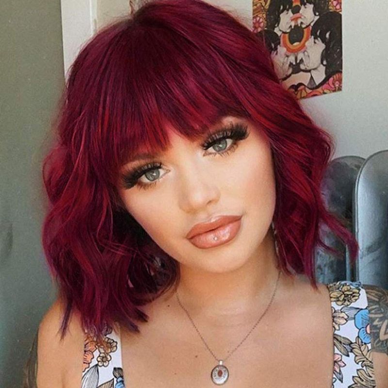 Photo 1 of Flandi Synthetic Short Curly Bob Wavy Wine Red Wig with Bangs for Women Shoulder Length Pastel Bob Style Synthetic Wigs with Air Bangs for White Women Curly Bob Wig Natural Looking Heat Resistant Wigs
