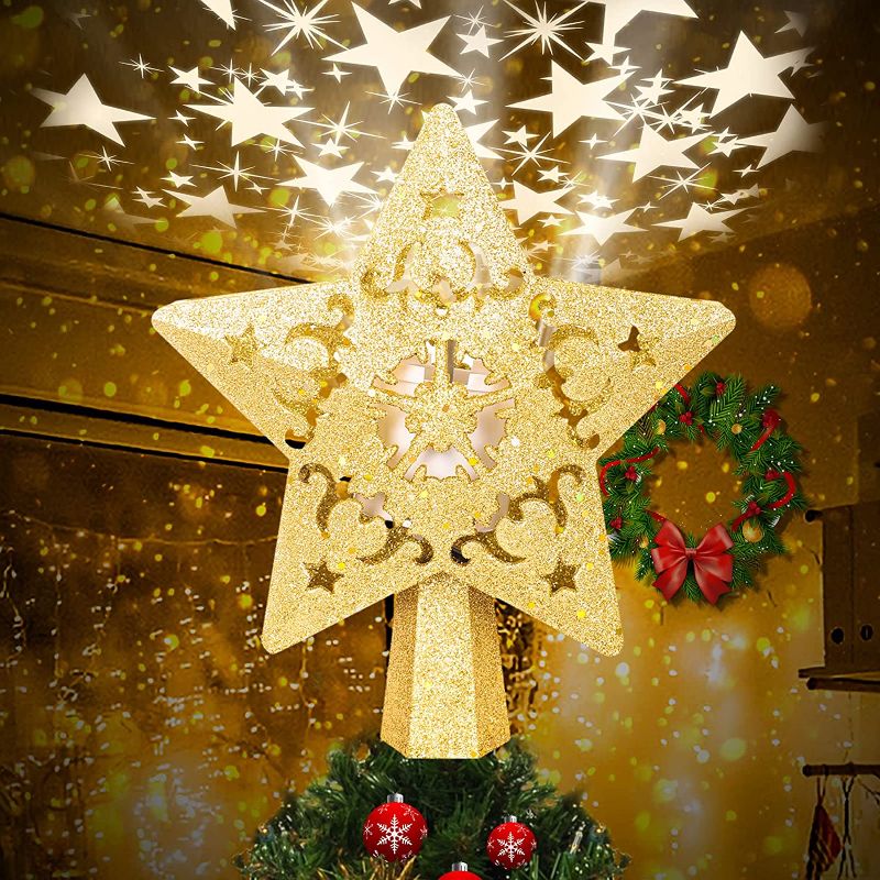 Photo 1 of Christmas Star Tree Topper with LED Projector, Lighted Tree Topper with Rotating Warm Star Shape Lights, 3D Hollow Gold Star Xmas Tree Topper for Christmas Tree Decorations