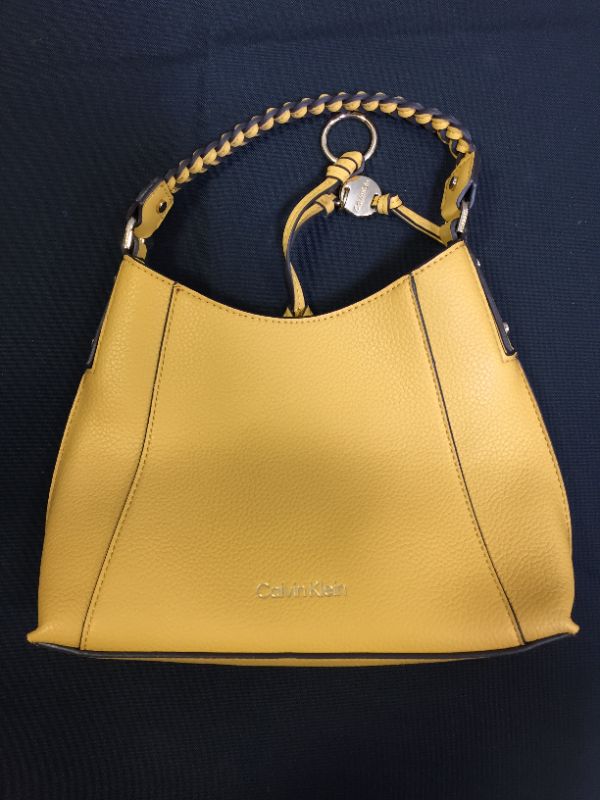 Photo 2 of Calvin Klein Shelly Triple Compartment Tote "SQUASH"
SCRATCHED AND USED , STAIN INSIDE BAG 