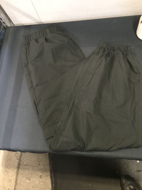 Photo 1 of BLACK CARGO PANTS NO DRAWSTRING OR BELTLOOP SIZE UNKNOWN