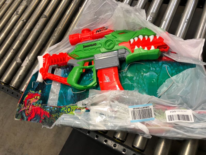 Photo 2 of NERF DinoSquad Rex-Rampage Motorized Dart Blaster, 10-Dart Clip, 20 Official Darts, 10-Dart Storage- T-Rex Dinosaur Design , Red
