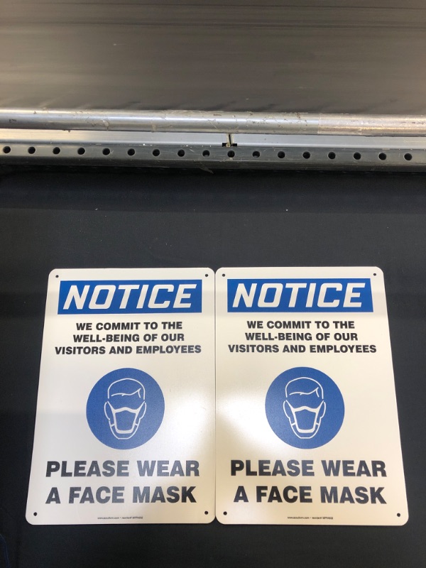 Photo 2 of Accuform-MPPA832VS"Notice WE Commit to The Well Being of Our Visitors and Employees - Please WEAR A FACE MASK" Sign, Adhesive Vinyl, 14" x 10", Pack of 2

