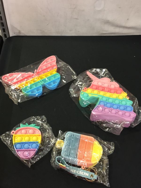 Photo 1 of Artifactz Pop It Fidget Toys - Pop Its Fidgets Toy Pack - Including 4 Sensory Toys - Pop It Unicorn Purse - Ice Cream Coin Purse - Butterfly Toy - Strawberry Keychain