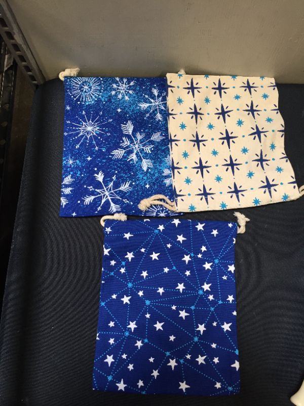 Photo 2 of Hallmark Blue Drawstring Christmas Gift Bag Bundle (3 Fabric Gift Bags: 8" X 10") Snowflakes and Stars for Christmas, Hanukkah, Weddings, Birthdays
