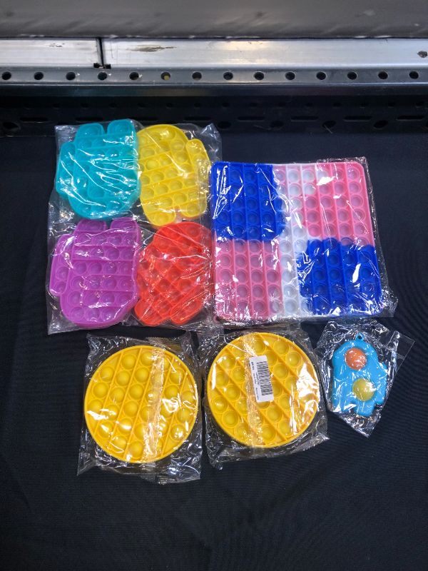 Photo 1 of bundle of pop socket toys 