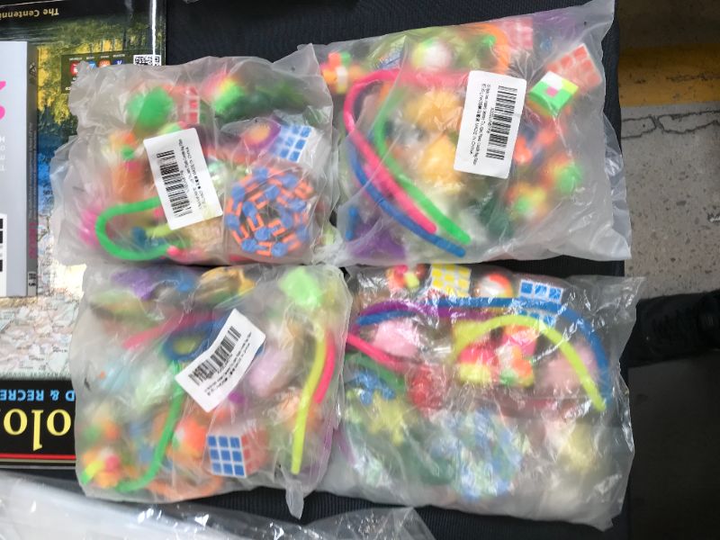 Photo 1 of bundle of 4 35 pc fidget toys 