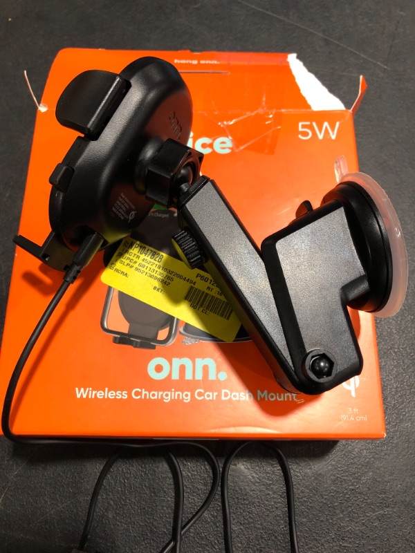 Photo 2 of Onn. Wireless Charging Car Dash Mount. OPEN BOX. PRIOR USE. 
