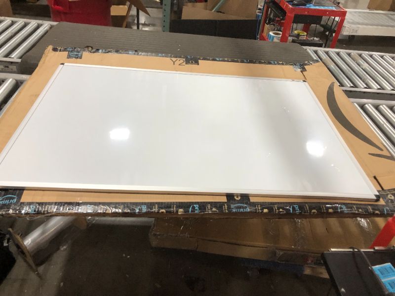 Photo 1 of VIZ-PRO Magnetic Dry Erase White Board, 31 X 47 Inches, Black Aluminium Frame CUT AND DENTED IN SPOTS
