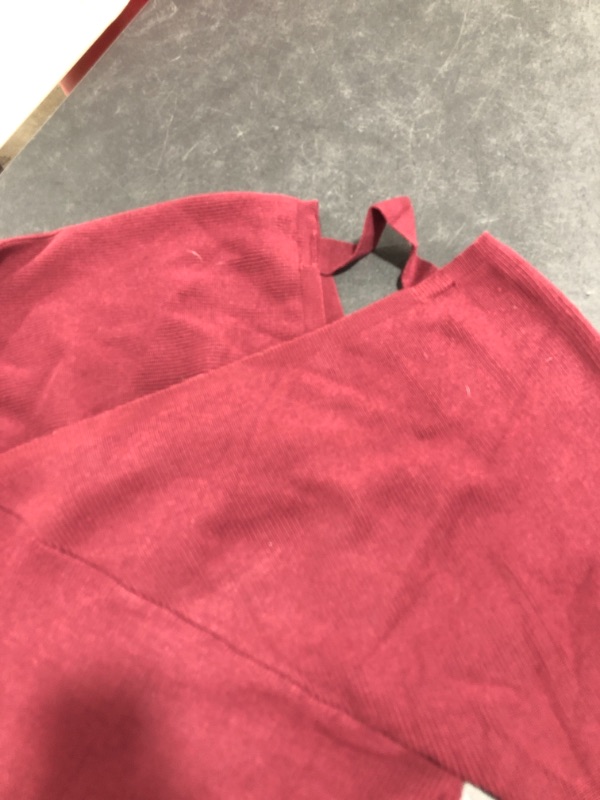 Photo 2 of WOMEN'S LONG SLEEVE CROSS STRAP VNECK SWEATER STLYE SHIRT. UNMARKED SIZE (APPROX. MEDIUM/LARGE). MAROON COLORED. PRIOR USE.