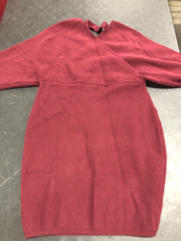 Photo 1 of WOMEN'S LONG SLEEVE CROSS STRAP VNECK SWEATER STLYE SHIRT. UNMARKED SIZE (APPROX. MEDIUM/LARGE). MAROON COLORED. PRIOR USE.