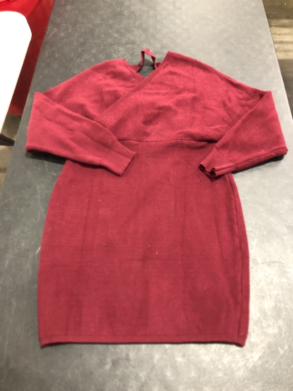 Photo 1 of WOMEN'S LONG SLEEVE CROSS STRAP VNECK SWEATER STLYE SHIRT. UNMARKED SIZE (APPROX. MEDIUM/LARGE). MAROON COLORED. PRIOR USE.