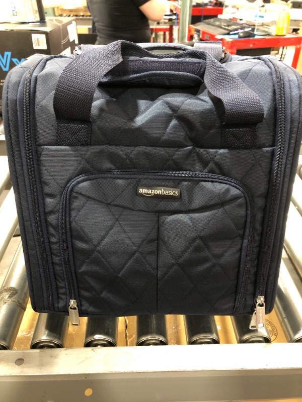 Photo 3 of Amazon Basics Underseat Carry-On Rolling Travel Luggage Bag, 14 Inches, Navy Blue Quilted. OPEN BOX.
