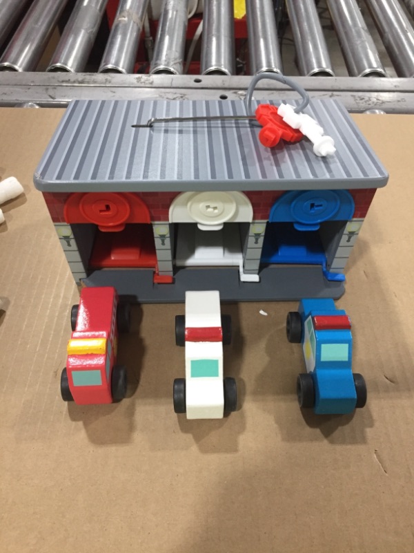 Photo 1 of Melissa & Doug Toy Keys and Cars Wooden Rescue Vehicles and Garage Red
