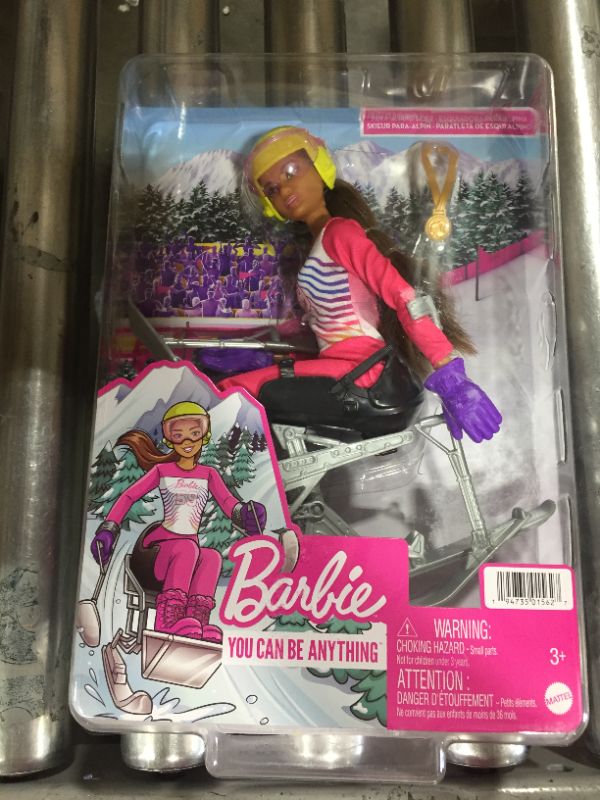 Photo 2 of Barbie Winter Sports para Alpine Skier Brunette Doll (12 in) with Shirt, Pants, Helmet, Gloves, Pole, Sit Ski & Trophy, Great Gift for Ages 3 and Up
