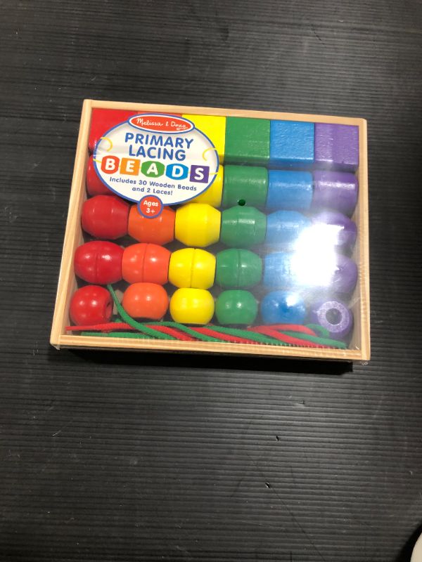 Photo 2 of Melissa & Doug Primary Lacing Beads - Educational Toy With 30 Wooden Beads and 2 Laces